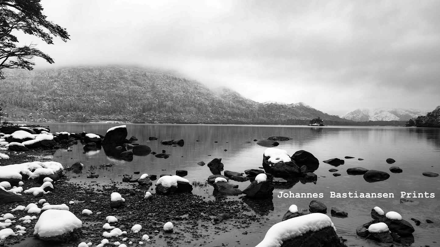 Still lakeside with snow
