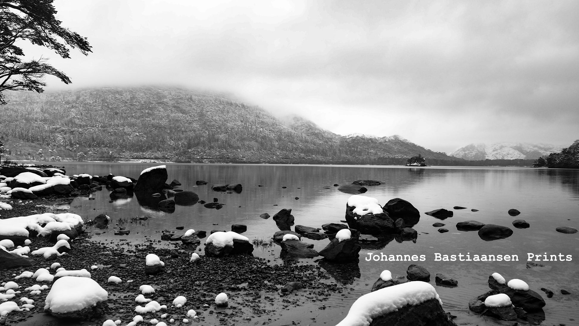 Still lakeside with snow